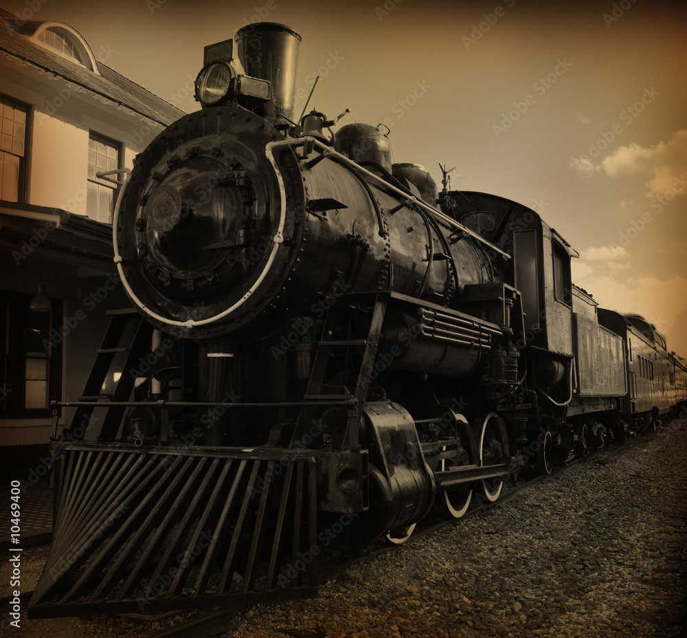 Naklejka premium Sepia toned shot of old fashioned steam train