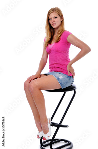 Portrait of beautiful young woman sitting on a stool © R. Gino Santa Maria