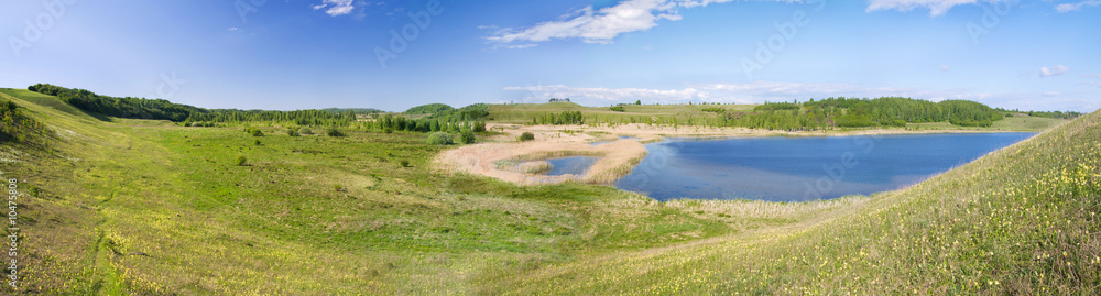 Panorama of beautiful green valley. Pskov region, Russia.