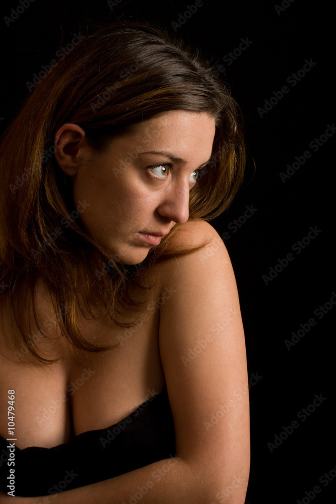Glamour image of a beautiful woman on black background Glamour image of a beautiful woman on black background