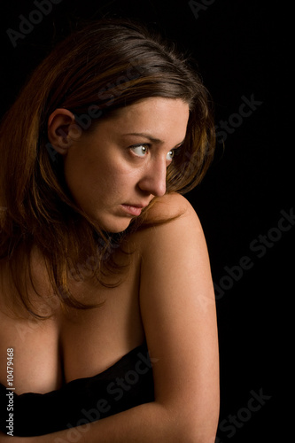 Glamour image of a beautiful woman on black background