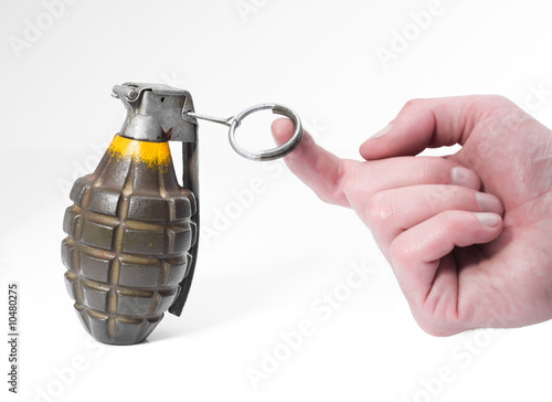 Bild auf Leinwand Green combat pineapple grenade about to be triggered