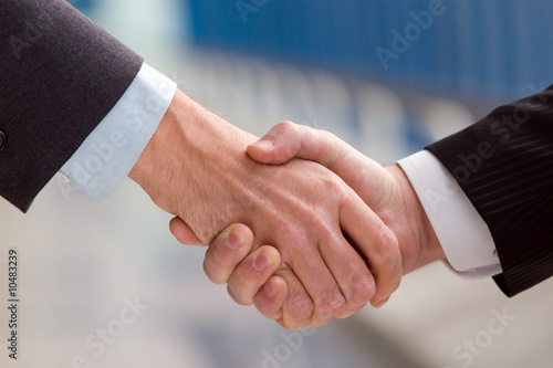 Two business men shaking hands