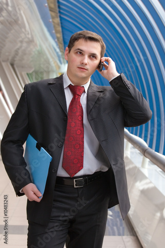 Young business man talking on mobile phone