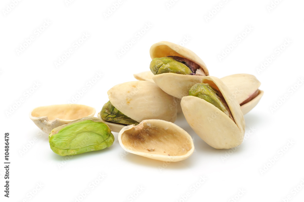 Heap of pistachios nuts in isolated white background Heap of pistachios nuts in isolated white background