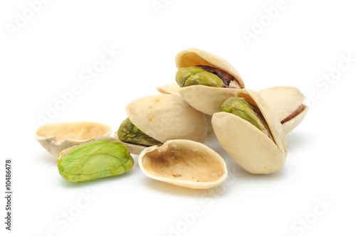 Heap of pistachios nuts in isolated white background