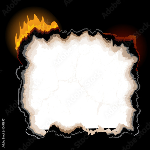 a piece of burning paper with jagged edges