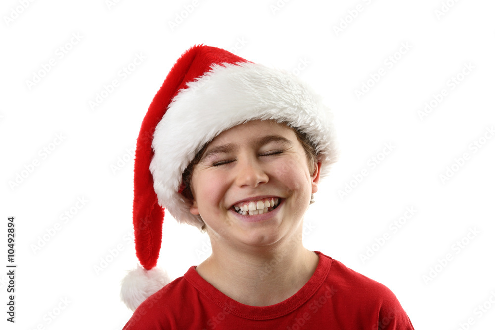 Christmas time - boy with Santa's hat isolated on white Christmas time - boy with Santa's hat isolated on white