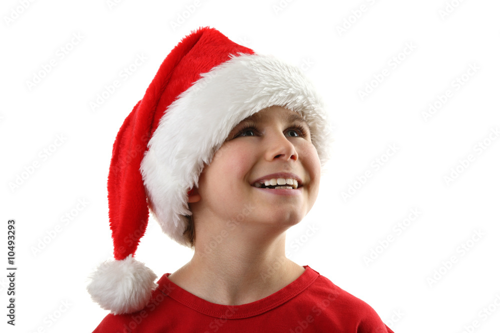 Christmas time - boy with Santa's hat isolated on white Christmas time - boy with Santa's hat isolated on white