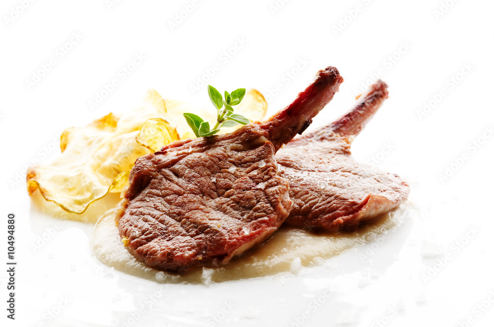 Grilled lamb cutlet on white plate
