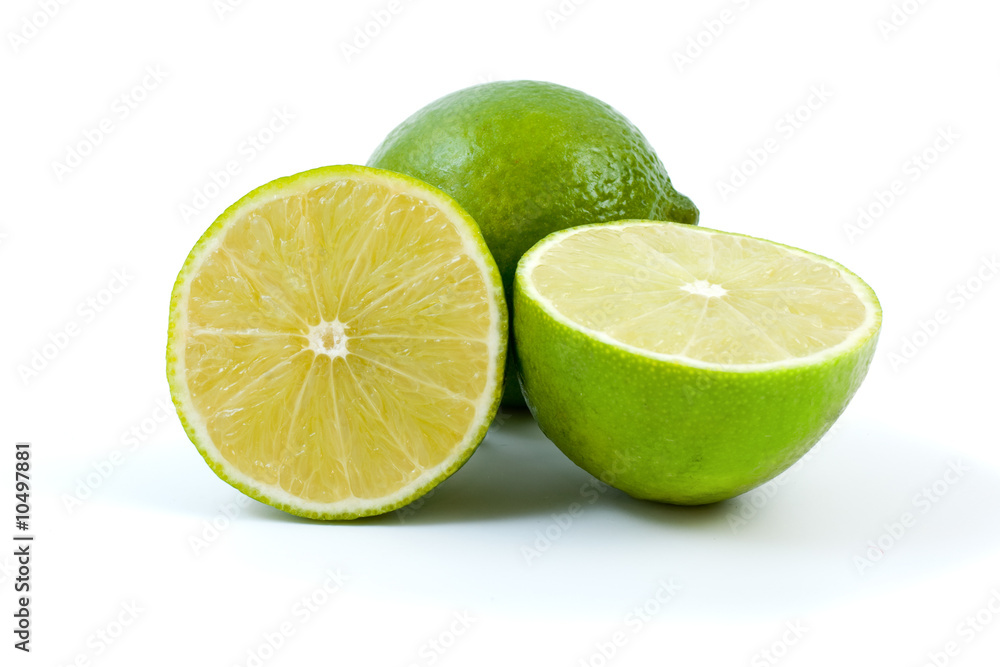 Limes. Whole and halves isolated on the white background Limes. Whole and halves isolated on the white background