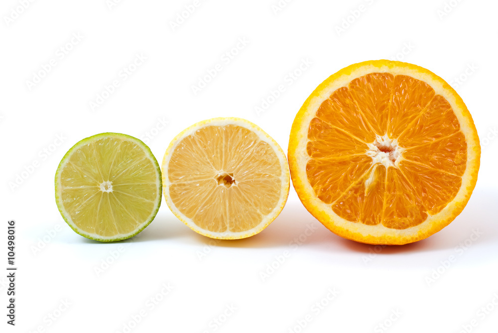 Halves of orange, lemon and lime isolated on the white Halves of orange, lemon and lime isolated on the white