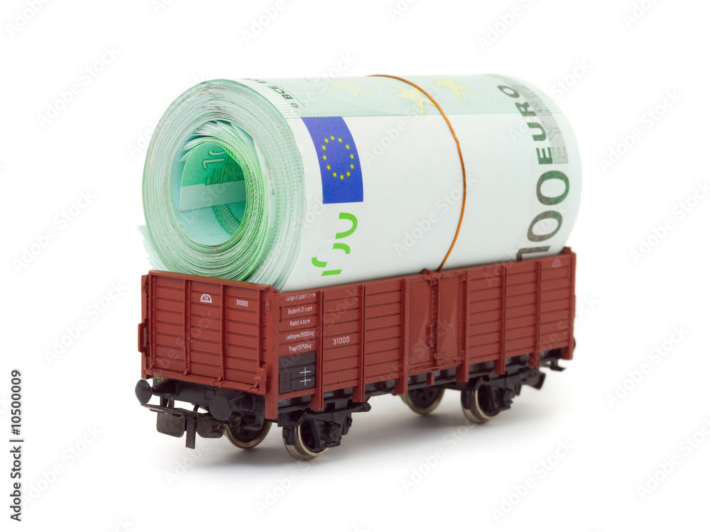 Fotografie Train with money isolated on white background