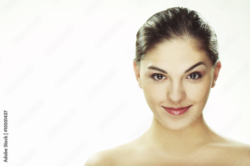 A happy young woman with big smile on white background A happy young woman with big smile on white background