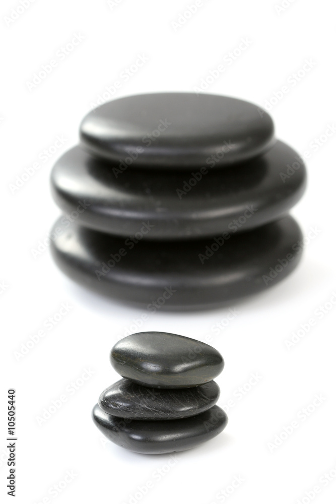 black pebbles isolated on white - health and beauty black pebbles isolated on white - health and beauty