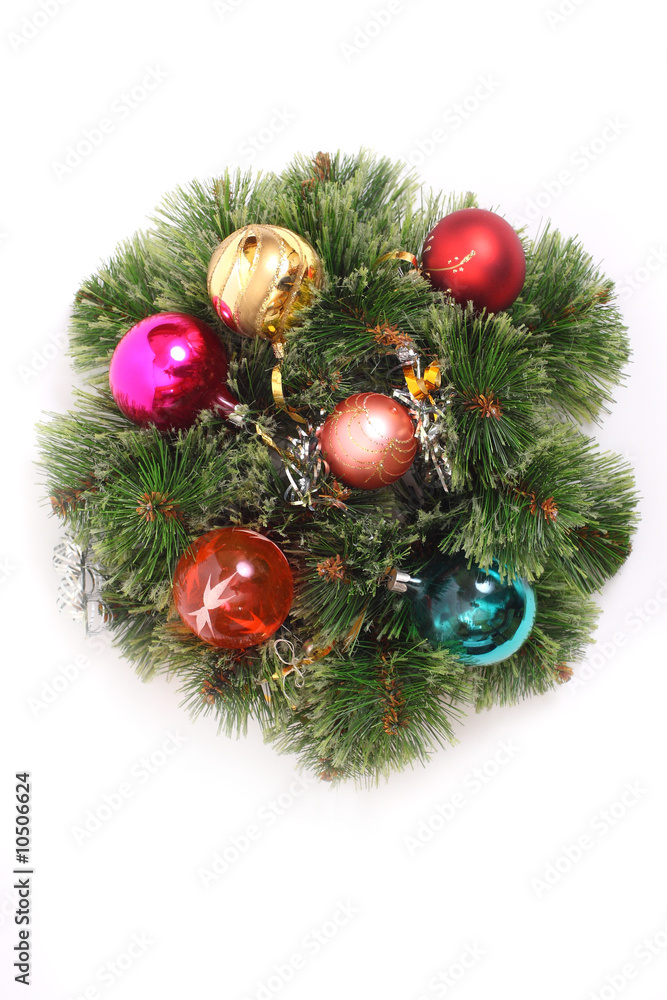 Christmas wreath with brightly colored baubles and ribbons