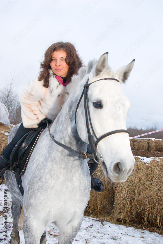 Fototapeta premium Girl on a horse.winter landscape