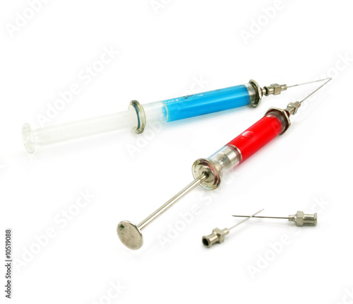 Two syringes with acid substance isolated on a white background