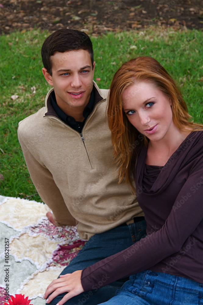 Young couple in an autumn forest picnic area Young couple in an autumn forest picnic area