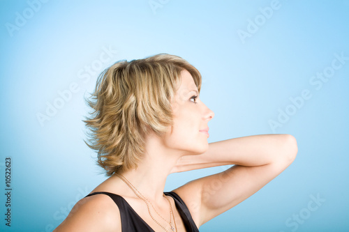 Portrait of attractive girl over blue background