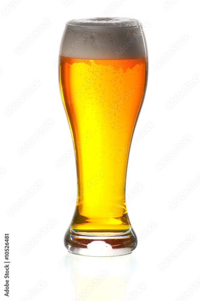 Glass of beer close-up with froth over white background Glass of beer close-up with froth over white background