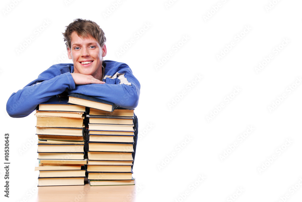 Portrait of smiling smart man journaled on heap of books Portrait of smiling smart man journaled on heap of books
