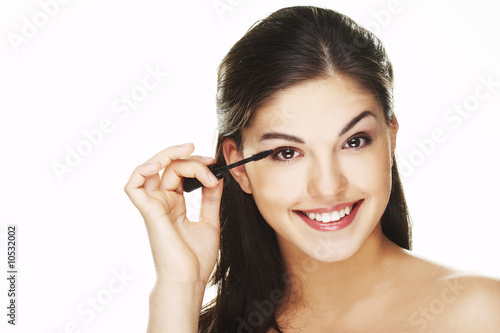 Pretty woman applying make up