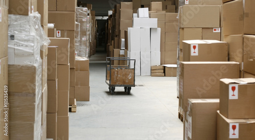warehouse corridor and handcart, carton stock photo