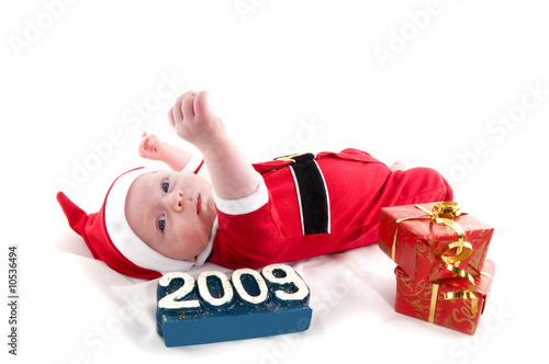 Little christmas baby with presents photo