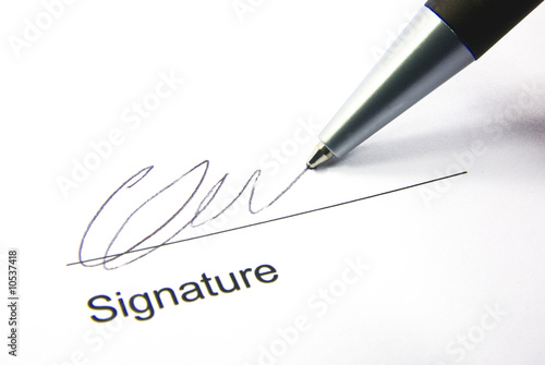 Detail view of the signature box of a contract with a pen. photo