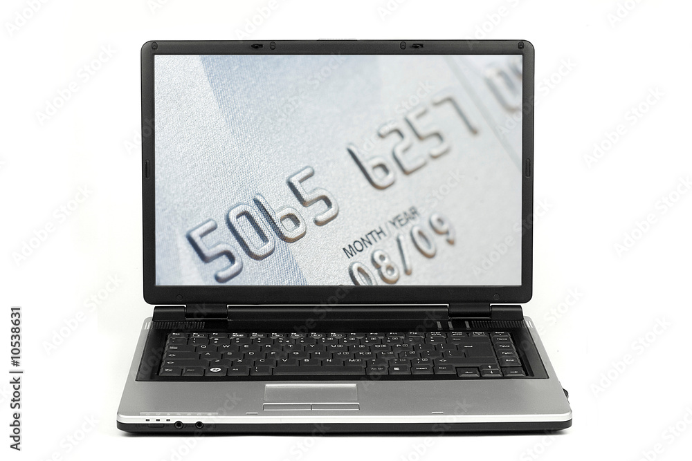 Close-up on credit card on laptop screen isolated Close-up on credit card on laptop screen isolated