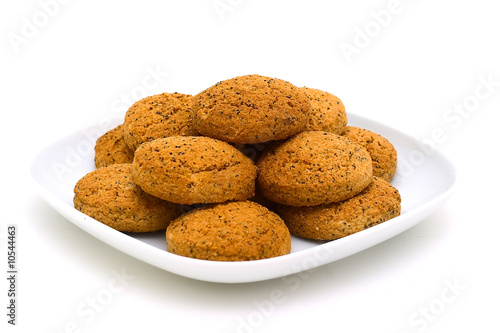 Oats cookies with a poppy on a plate