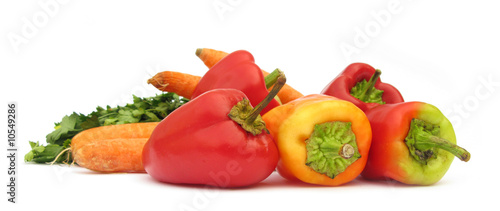 Bell peppers paprika pile isolated on white background
