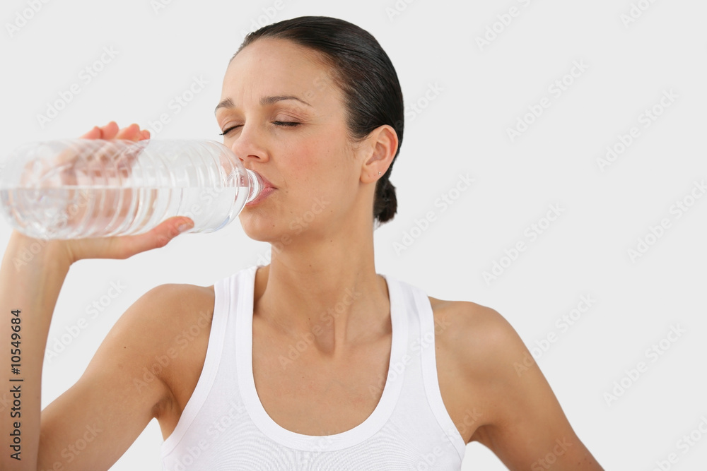 Portrait of a beautiful woman drinking from a bottle of water Portrait of a beautiful woman drinking from a bottle of water