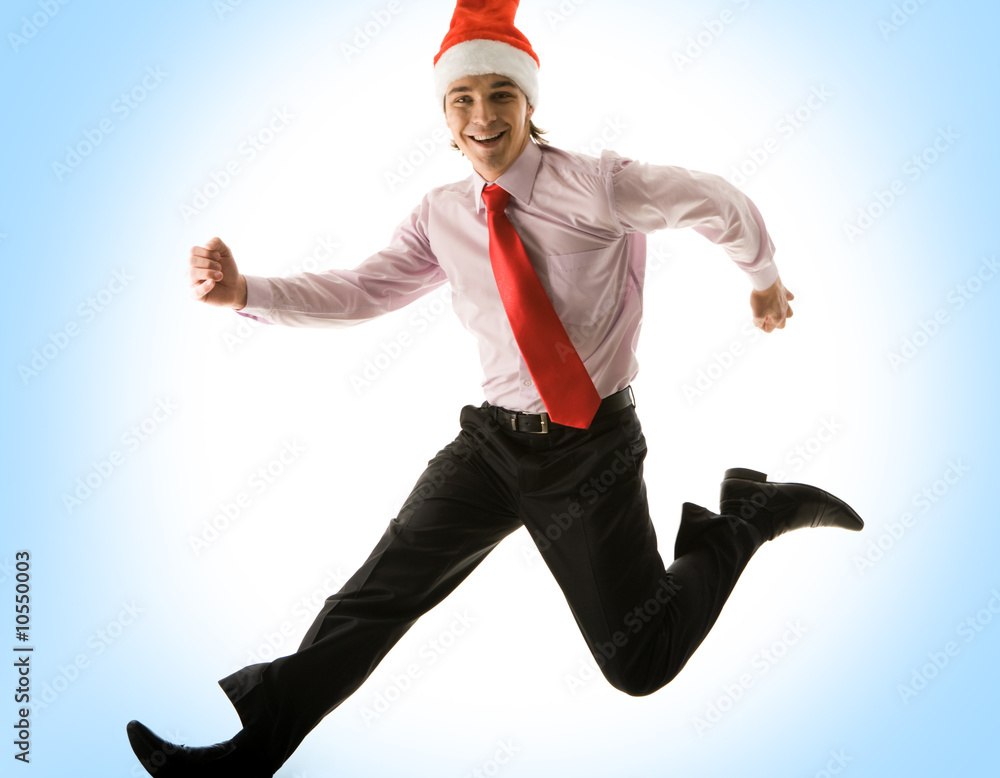 Photo of happy man in santa cap running somewhere