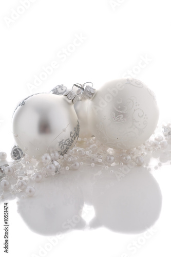 Pretty silver christmas baubles on white background