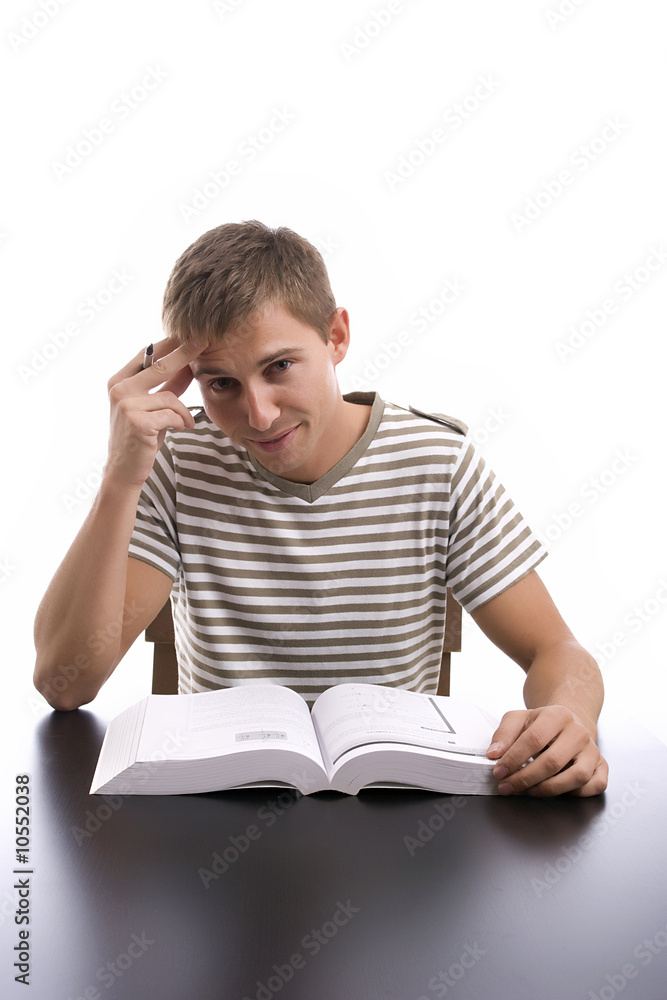 Young boy studying, isolated over white background Young boy studying, isolated over white background