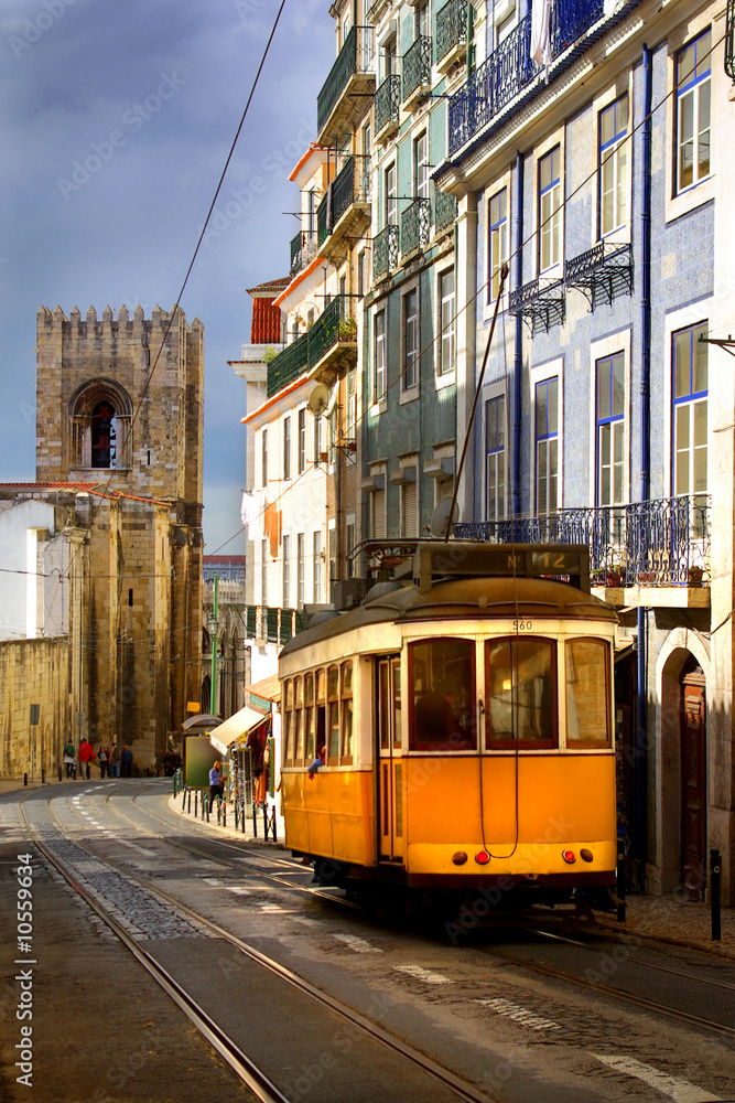 View of an old Lisbon street with the traditional yellow tram