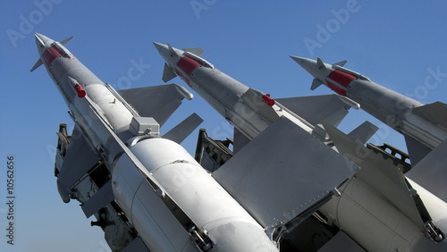 Three missiles against clear blue sky