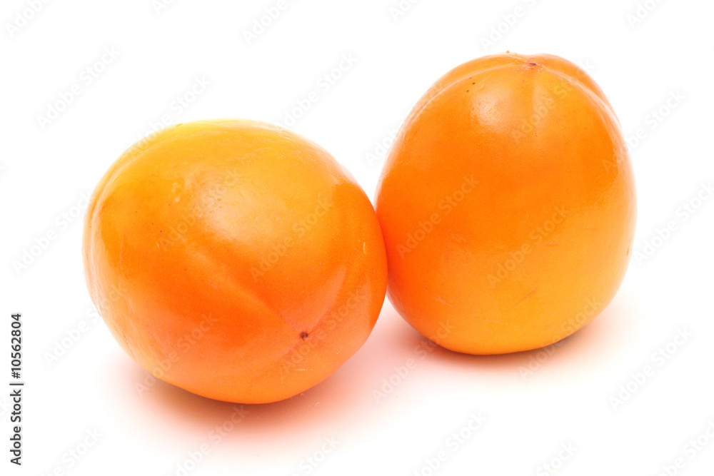 Pair of juicy ripe persimmons