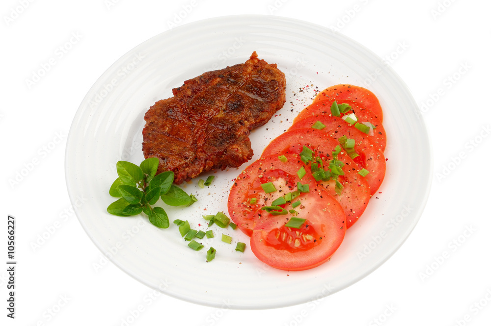 Grilled steak with vegetable salad isolated on white Grilled steak with vegetable salad isolated on white