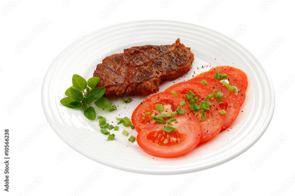 Grilled steak with vegetable salad isolated on white Grilled steak with vegetable salad isolated on white