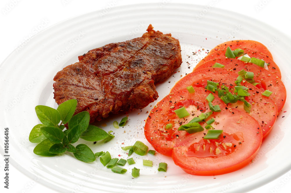 Grilled steak with vegetable salad isolated on white