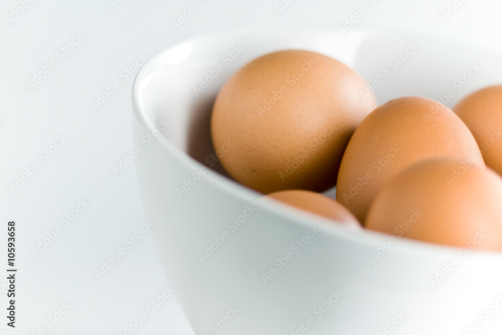 Fresh Brown Eggs in Tilted White Bowl Fresh Brown Eggs in Tilted White Bowl