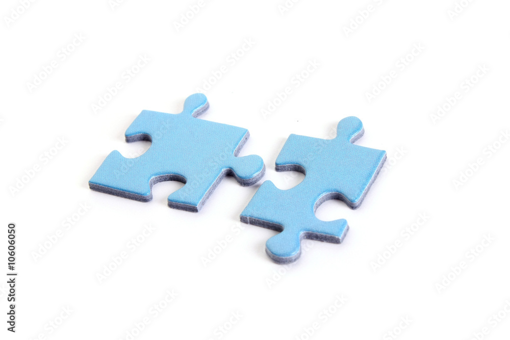 Two pieces of puzzle, isolated on white background Two pieces of puzzle, isolated on white background