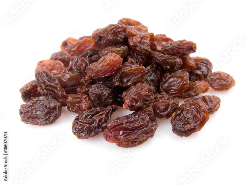 Pile of raisins isolated on white background.