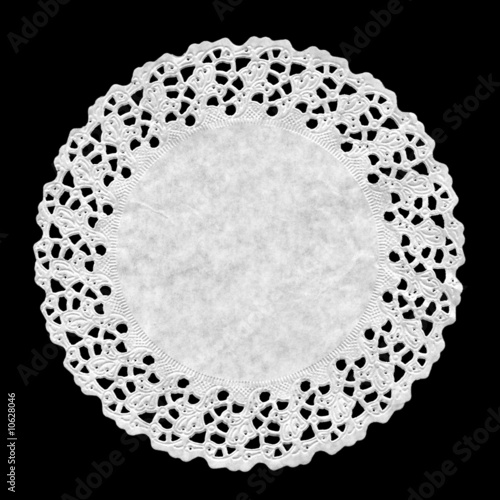 Small circular ornamental doily mat on black background