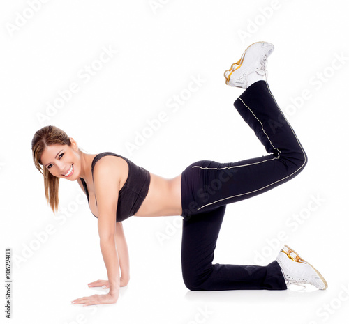 Young woman exercising on the floor