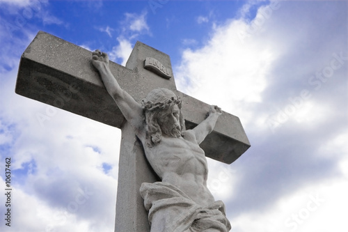 Crucifix, clouded background.