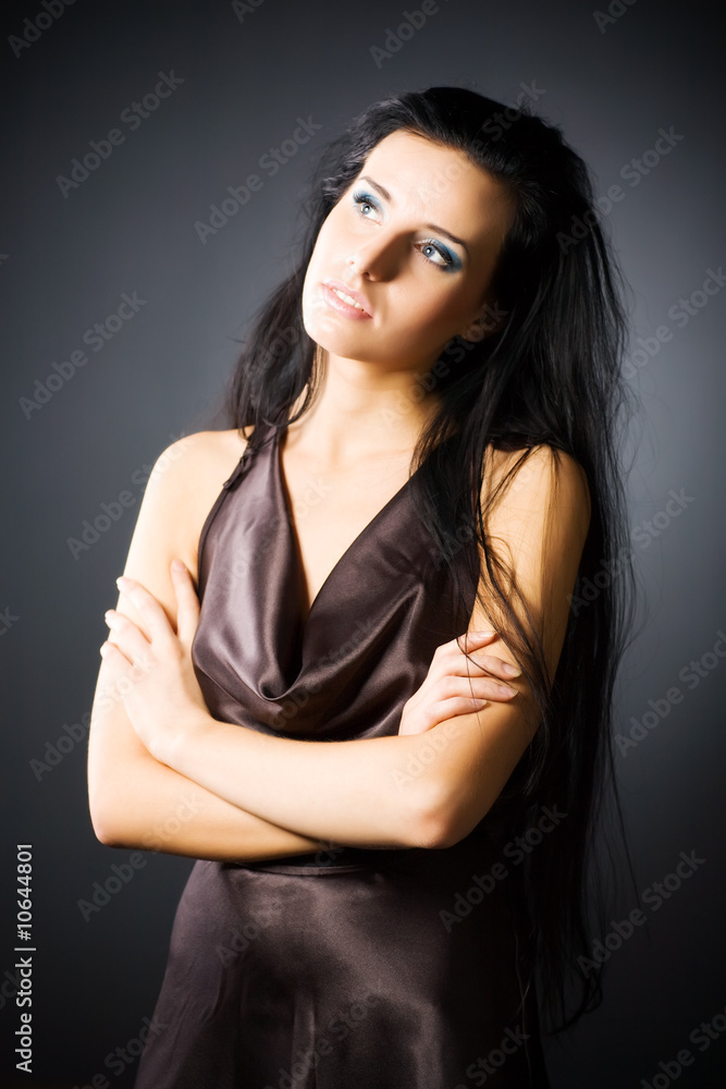 Slim brunette woman looking aside Slim brunette woman looking aside